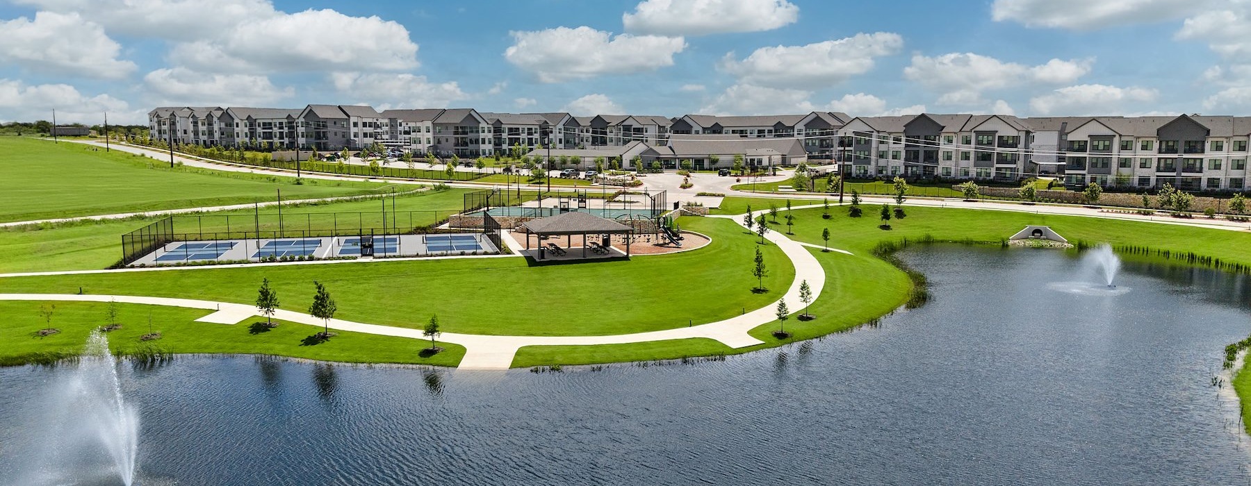 aerial view of a lake and community area