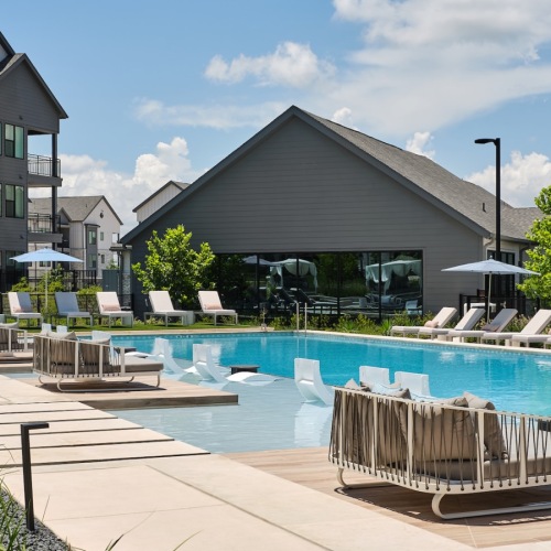 Sparkling swimming pool resort style pool with seating