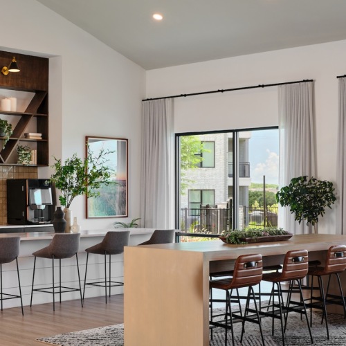 Access to resident-only features community kitchen with seating tables and windows