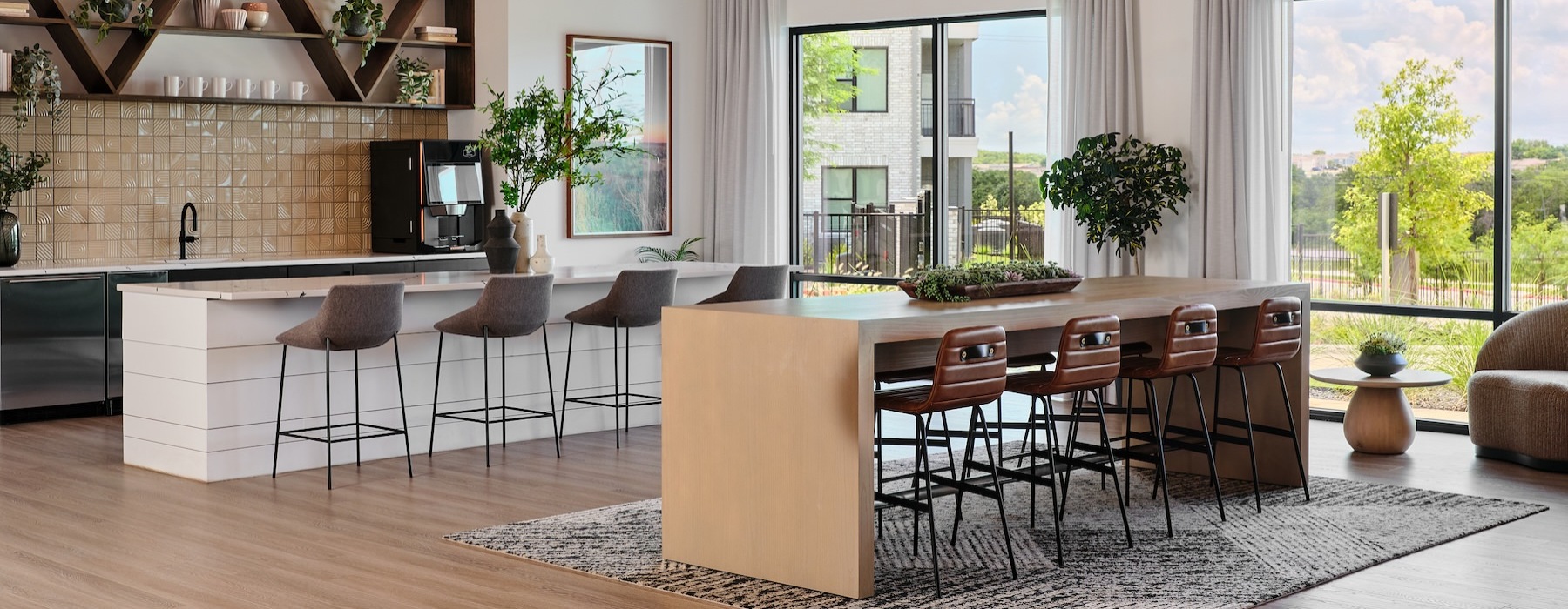 community kitchen with seating tables and windows