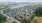 an arial view of a town with many buildings and a pond